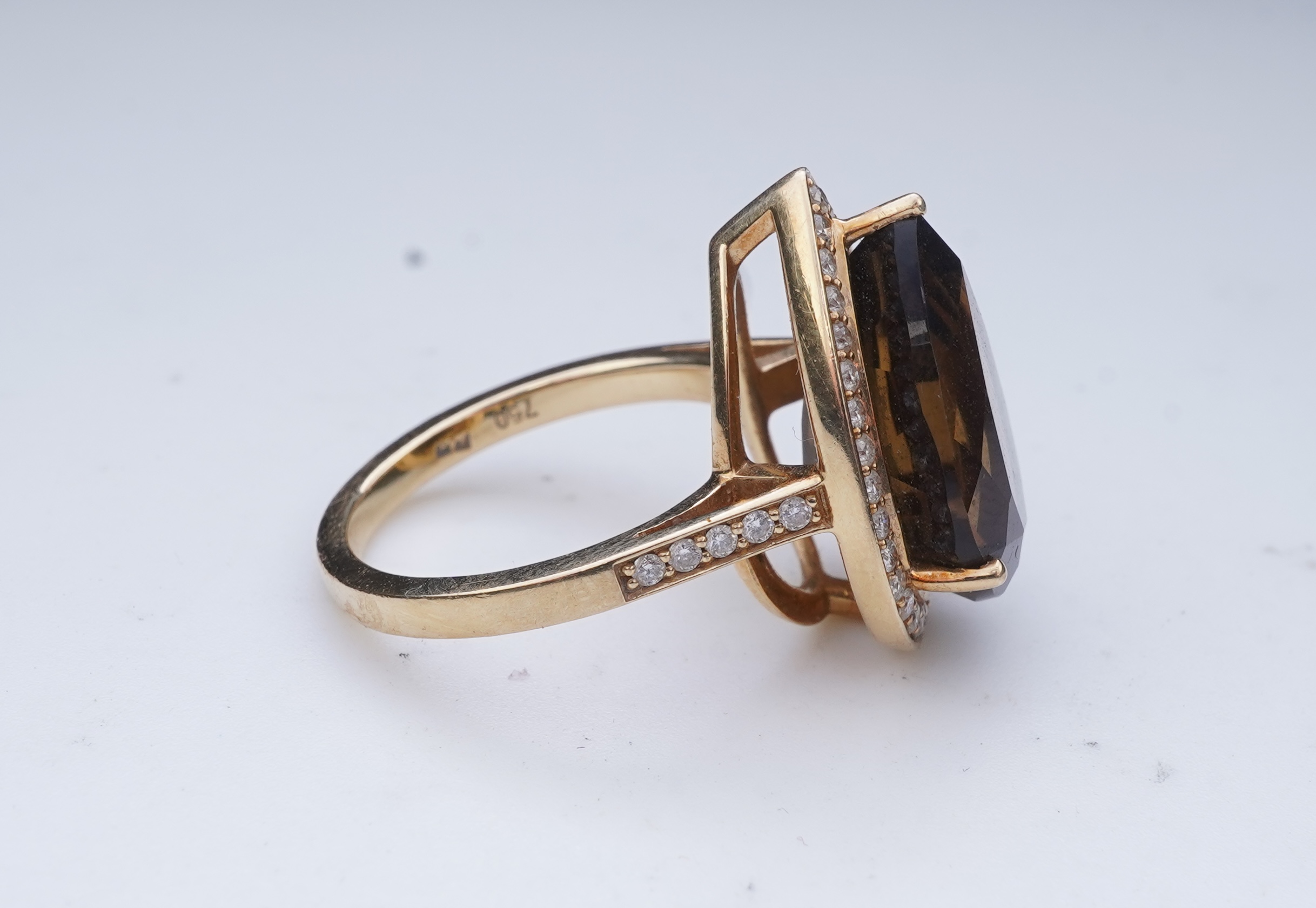 A smoky quartz and diamond ring
